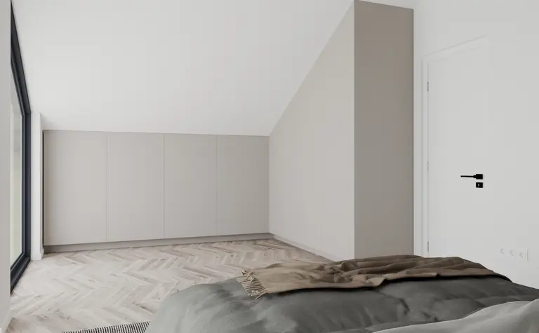 Wnętrze poddasza z minimalistycznym wystrojem, szarymi meblami i nowoczesnym stylem.
