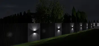Widok na industrialny mur z lampami, roślinność w stylu japandi, nowoczesne oświetlenie.