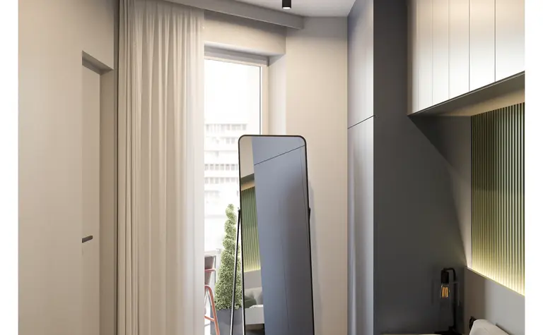 Sypialnia w stylu industrialnym i minimalistycznym z dużym lustrem i zielonymi akcentami.