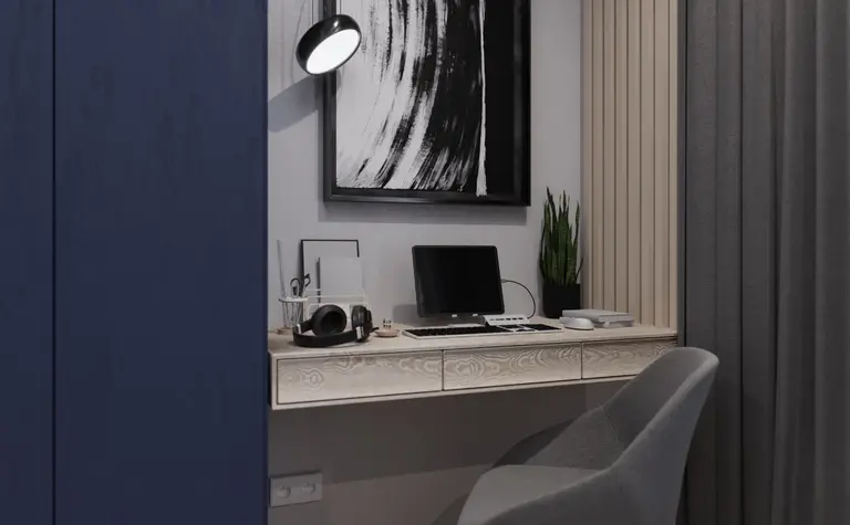 Eklektyczny i minimalistyczny gabinet z niebieską szafą oraz nowoczesnym biurkiem.