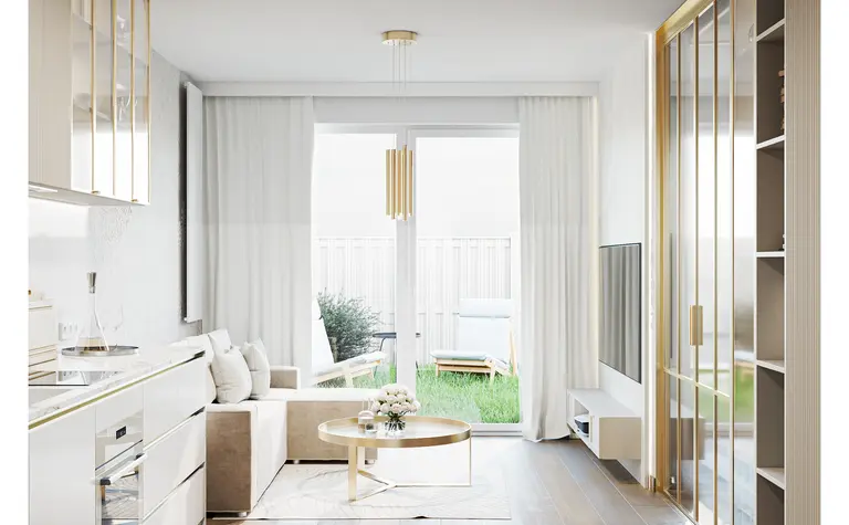 Wnętrze kuchni w stylu glamour z minimalistycznymi akcentami, nowoczesnymi meblami i dużymi oknami.