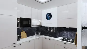 Kuchnia w stylu eklektycznym z minimalistycznymi białymi meblami i nowoczesnym blatem.