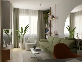 Wnętrze salonu w stylu soft minimalizm z zieloną sofą, roślinami i drewnianymi akcentami.