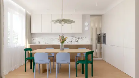 Wnętrze jadalni w stylu art deco z drewnianym stołem i zielonymi krzesłami.