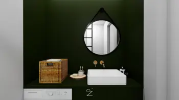 Wnętrze łazienki w stylu industrialnym i minimalistycznym z zielonymi ścianami i białą umywalką.