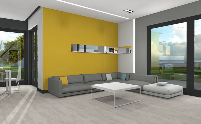 Wnętrze salonu w stylu industrialnym z szarym narożnikiem oraz żółtą ścianą.