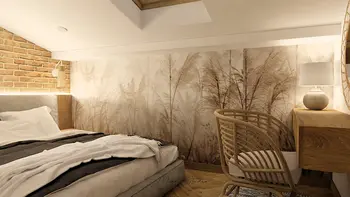 Sypialnia boho z ceglaną ścianą i drewnianym biurkiem.
