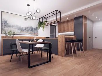 Nowoczesna kuchnia w stylu industrialnym z drewnianymi meblami i minimalistycznym oświetleniem.
