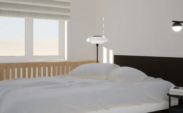Sypialnia w stylu japandi, minimalistycznym i skandynawskim z białym łóżkiem i drewnianymi detalami.