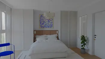 Sypialnia w stylu art deco z beżowymi meblami i niebieskim obrazem