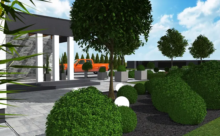 Widok na nowoczesny ogród z zielonymi krzewami, industrialnymi elementami i minimalistycznym otoczeniem.