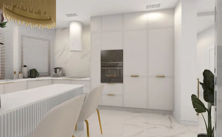 Nowoczesna kuchnia z białymi meblami, złotymi detalami i eleganckim oświetleniem.