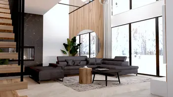 Wnętrze salonu w stylu industrialnym i nowoczesnym z szarym narożnikiem i dużymi oknami.
