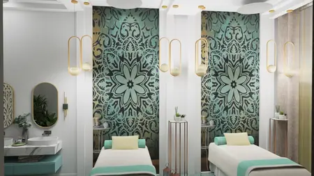 Wnętrze spa z dwoma łóżkami do masażu, zielonymi akcentami i nowoczesnym oświetleniem.