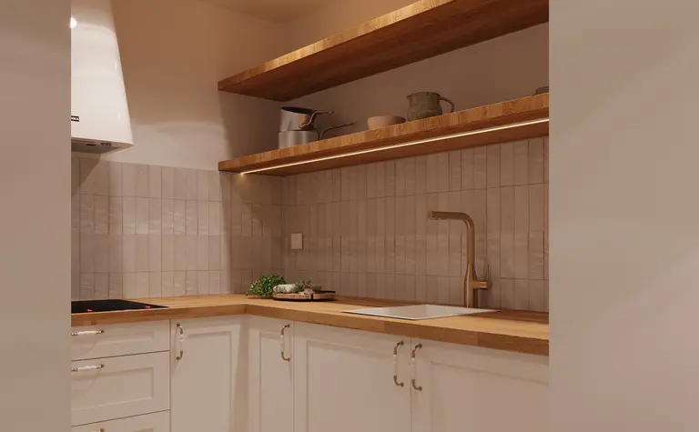 Minimalistyczna kuchnia z białymi meblami i drewnianymi akcentami.
