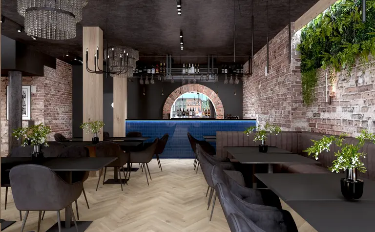Wnętrze restauracji z industrialnym stylem, drewniane elementy, bar i roślinność.