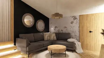 Wnętrze salonu w stylu boho i nowoczesnym z szarym narożnikiem i drewnianym stołem.