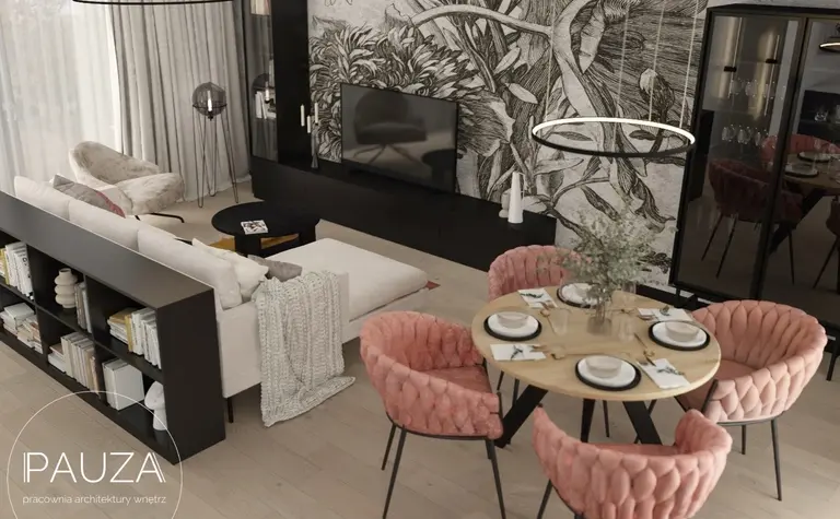 Nowoczesny salon z różowymi krzesłami i dużą sofą, telewizor na ścianie.