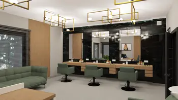 Wnętrze salonu z glamour i industrialnym stylem, zielone fotele, drewniany blat, lustra.