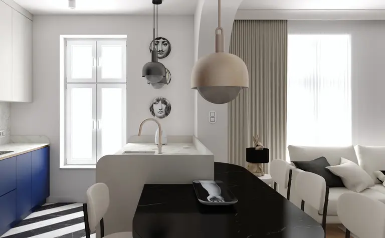 Wnętrze kuchni w stylu art deco i nowoczesnym z niebieskimi meblami i białym blatem.