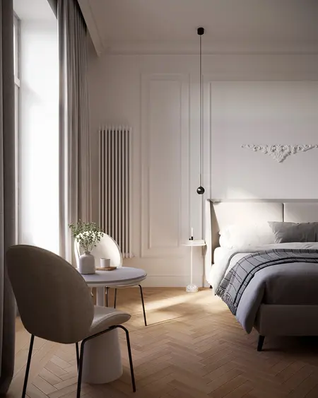 Wnętrze sypialni w stylu art deco i nowoczesnym z beżowym łóżkiem, szarymi akcentami oraz naturalnym światłem.