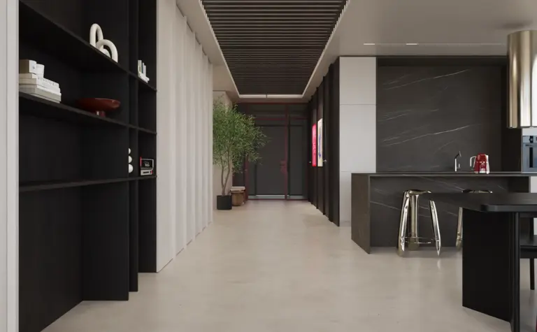 Wnętrze nowoczesnej kuchni z minimalistycznym designem, czarnymi meblami i jasnym blatem.