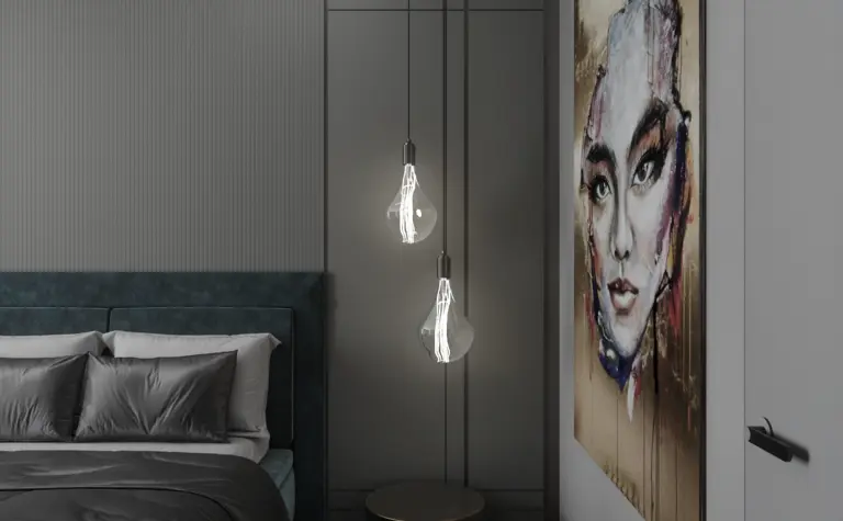 Minimalistyczna sypialnia z zielonym łóżkiem i nowoczesnymi lampami.