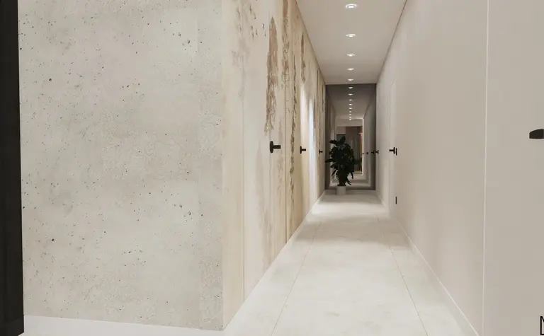 Korytarz z jasnymi ścianami i rośliną w doniczce, nowoczesny design.