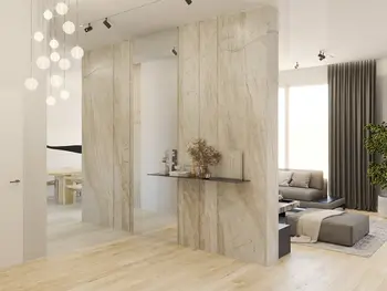 Wnętrze salonu w stylu minimalistycznym z nowoczesnym oświetleniem i jasnymi ścianami.