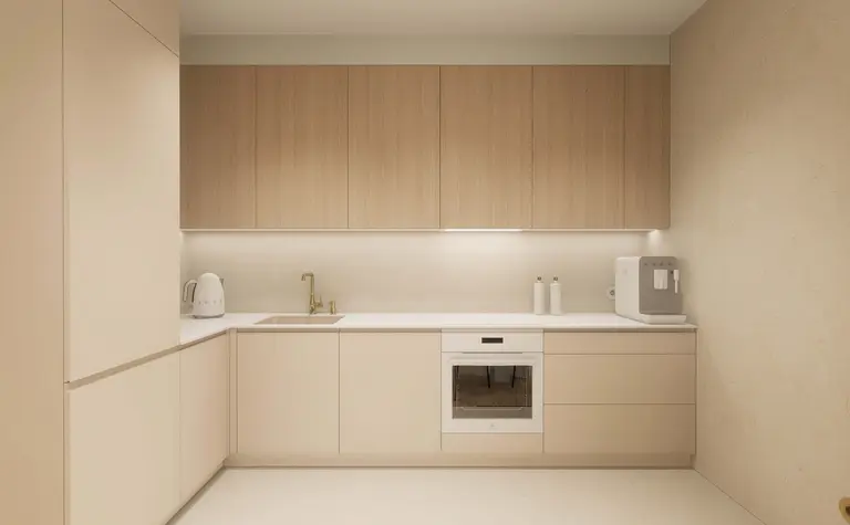 Kuchnia w stylu japandi z minimalistycznymi meblami i nowoczesnym wyposażeniem.