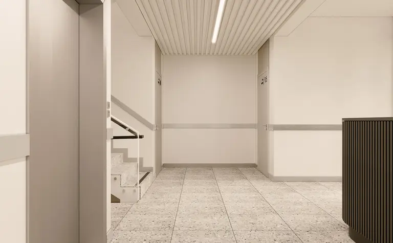 Korytarz z minimalistycznym wystrojem, nowoczesne ściany i podłoga w stylu soft minimalizm.