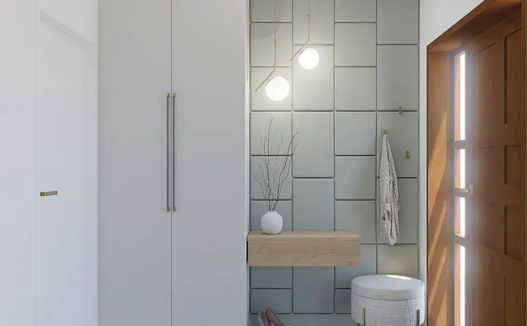 Przedpokój z szarymi płytkami, drewnianymi elementami i minimalistycznym wystrojem w stylu quiet luxury.