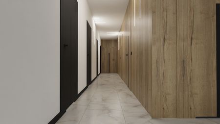 Wnętrze korytarza z drewnianymi panelami i czarnymi drzwiami, nowoczesny design