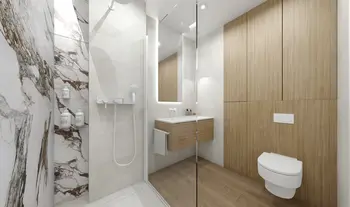 Nowoczesna łazienka z minimalistycznym designem, drewnianymi elementami i eleganckimi płytkami.