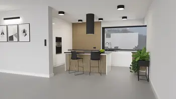 Wnętrze kuchni z drewnianymi detalami, białymi meblami, roślinami i nowoczesnymi akcentami industrialnymi.