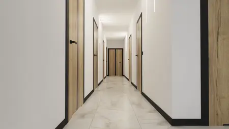 Korytarz z drewnianymi drzwiami i jasnymi ścianami, nowoczesny styl.