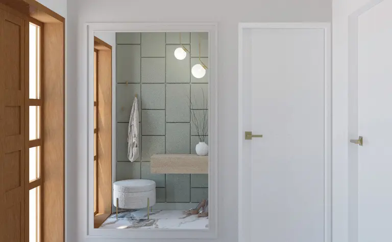 Wnętrze przedpokoju w stylu quiet luxury z szarymi płytkami, białym meblem i lustrem.
