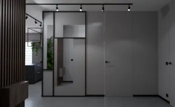 Przedpokój w stylu industrialnym i minimalistycznym z szarymi ścianami i nowoczesnymi detalami.