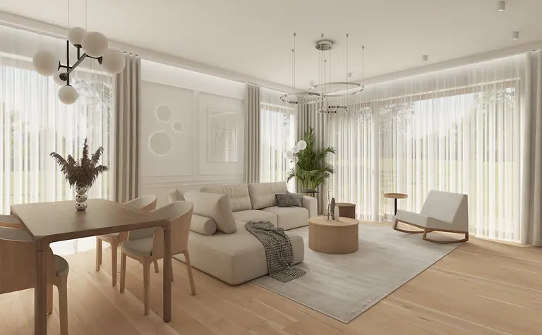 Wnętrze salonu w stylu japandi i minimalistycznym, z jasnymi meblami i roślinami.