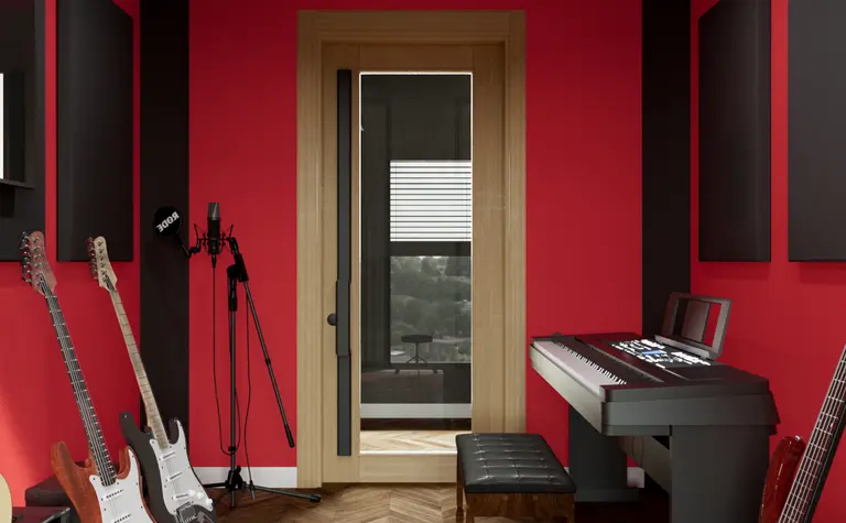 Wnętrze eklektycznego pokoju do nagrywania z czerwonymi ścianami i instrumentami muzycznymi.