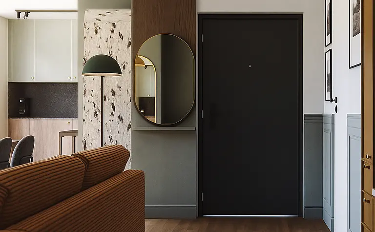 Wnętrze przedpokoju z brązową kanapą, lustrem i nowoczesnymi detalami w stylu art deco.