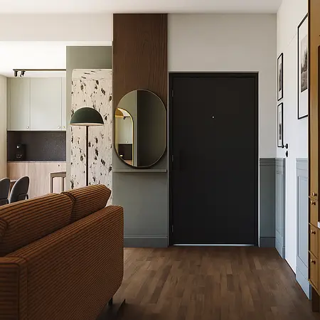 Wnętrze przedpokoju z brązową kanapą, lustrem i nowoczesnymi detalami w stylu art deco.