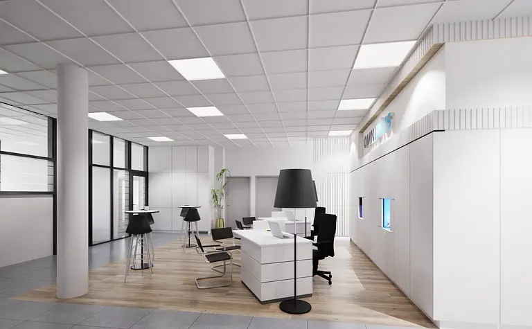 Nowoczesne biuro z białymi meblami i industrialnymi akcentami, jasna przestrzeń robocza.