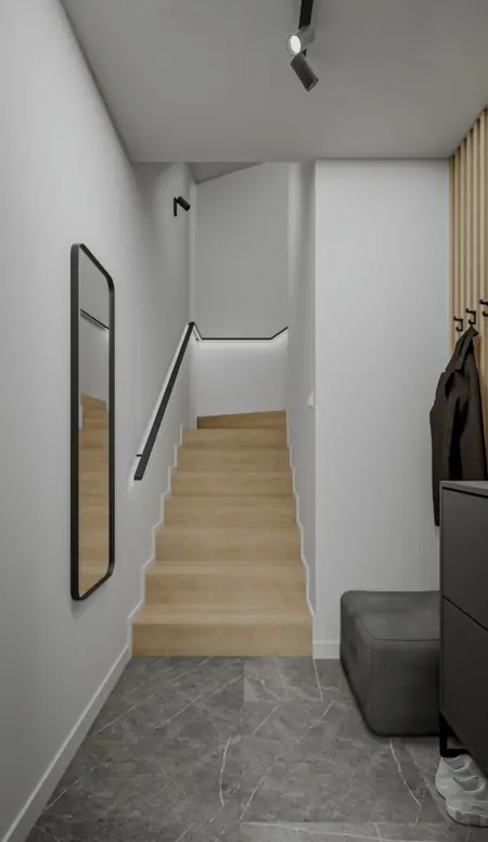 Przedpokój z minimalistycznym wystrojem, drewnianymi schodami i nowoczesnym lustrem.