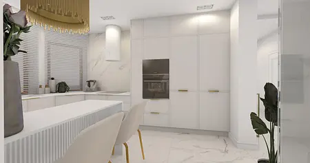 Nowoczesna kuchnia z białymi meblami, złotymi detalami i eleganckim oświetleniem.
