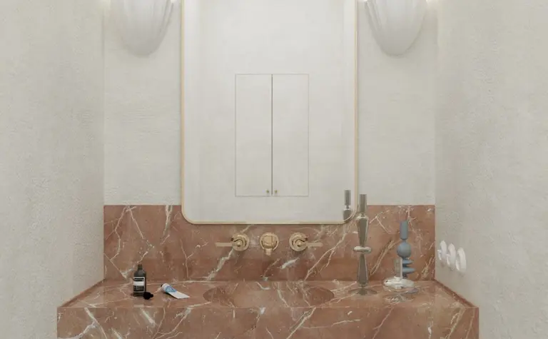 Wnętrze łazienki z marmurową umywalką, lustrem i elementami art deco, minimaluxe, quiet luxury.