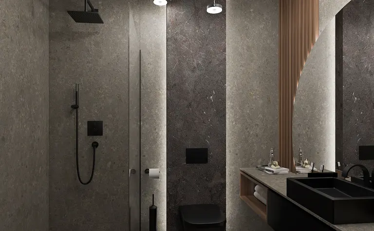 Nowoczesna łazienka z minimalistycznym wystrojem, szarymi ścianami i czarnymi detalami.