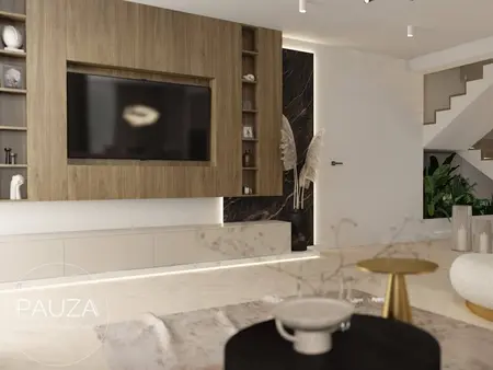 Wnętrze salonu z telewizorem, drewnianą ścianą i roślinami, styl minimaluxe i nowoczesny.