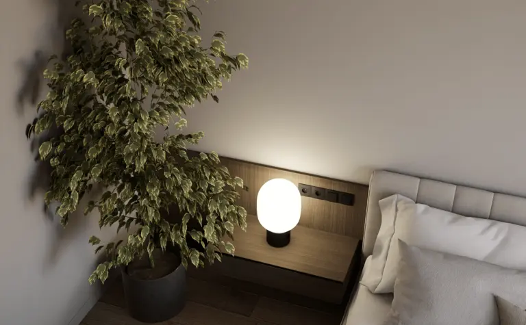 Sypialnia z minimalistycznym wystrojem, nowoczesną lampą i prowansalską rośliną.