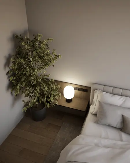 Sypialnia z minimalistycznym wystrojem, nowoczesną lampą i prowansalską rośliną.